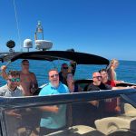 Having a good time aboard a yacht with your group of friends.