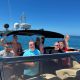 Having a good time aboard a yacht with your group of friends. 1